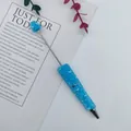 Blue mermaid bead ballpoint pen with heart detail and sparkling finish for SKU selection. - 1.0mm Bullet Tip / Light Blue