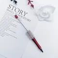 Elegant metallic red ballpoint pen decorated with white pearls and shiny crystals - 1.0mm Bullet Tip / Red