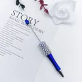 Elegant blue beaded ballpoint pen decorated with white pearls and rhinestones - 1.0mm Bullet Tip / Klein Blue