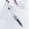 Elegant black ballpoint pen featuring luxurious white pearl and rhinestone beaded details. - 1.0mm Bullet Tip / Black
