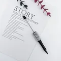Elegant black ballpoint pen featuring a white pearl and rhinestone beaded barrel design - 1.0mm Bullet Tip / Pearlescent Black