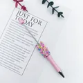 Macro view of a pink beaded ballpoint pen featuring colorful rainbow sprinkle beads - 1.0mm Bullet Tip / Khaki Light Pink