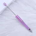 Elegante bolígrafo de cuentas violeta galvanizado UV sobre fondo de felpa blanca. - Paquete Individual / Morado Morandi