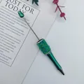 DIY beaded pen with green metallic finish and mermaid crystal beads for crafting. - Teal