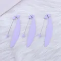Three purple candy-colored feather bookmarks with heart, star, and butterfly charms - Taro Purple