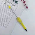 DIY beadable pen in yellow featuring shimmering mermaid beads and rhinestone accents - Yellow