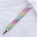 Rainbow rhinestone retractable ballpoint pen with rose gold accents on white fur background. - 1.0mm Bullet Tip / Rainbow (Rose Gold Hardware)