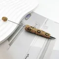 Luxury gold leopard print rhinestone pen with beaded design detail - Gold