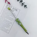 Handmade DIY beadable ballpoint pen featuring elegant green crushed stones and rhinestones - Wizard Of Oz Green Style