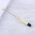 Lindo bolígrafo retráctil beige para cuentas con un botón rojo de carita sonriente - Amarillo Claro (101)