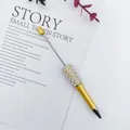 Elegant yellow beaded ballpoint pen featuring rhinestone and pearl embellishments - 1.0mm Bullet Tip / Amber Yellow