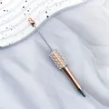 Elegant rose gold ballpoint pen decorated with white pearls and crystals on white tray. - 1.0mm Bullet Tip / UV Rose Gold