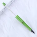 Bright green DIY beaded ballpoint pen with metal rod for personalized creative crafting projects - Verdant