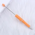 Handmade DIY beadable ballpoint pen in speckled orange finish on white fur background. - 1.0mm Bullet Tip / Orange (113)