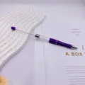 Purple DIY empty tube bead pen featuring an extended metal rod for custom beads - 1.0mm Bullet Tip / Candy Purple