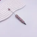 Stylo bille perlé avec strass colorés étincelants et détail élégant de cœur cristal - Rose