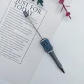 DIY beaded pen featuring iridescent mermaid beads and elegant rhinestone details for crafting. - Gray