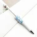 Elegant white beadable ballpoint pen with blue star-shaped glitter sequin decoration - 1.0mm Bullet Tip / White