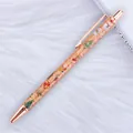 Rose gold Christmas ballpoint pen featuring gold glitter and festive patterns - Christmas Orange (Rose Gold Trim)