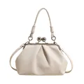 Detailed view of cream pleated cloud handbag with elegant silver metal ball clasp - White