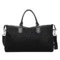 Front view of a large black leopard print travel duffle bag with adjustable shoulder strap - Black