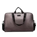 Front view of large capacity taupe travel bag with durable black nylon straps and handles - Khaki