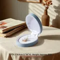 Light blue flocked velvet jewelry storage box featuring a pearl clover necklace - Pendant Box / Starry Blue
