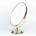 Eleganter goldener ovaler Tisch-Make-up-Spiegel mit doppelseitigem Schwenkdesign - Größe 1 Packung / Gold