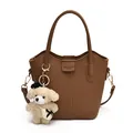 Elegant brown pebbled leather bucket bag featuring a plush teddy bear keychain - Bag Only (No Charm) / Brown