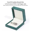 Elegant cyan PU leather brooch jewelry gift box measuring 9x9x4cm for stylish storage - Brushed PU Leather Style / Cyan