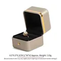 Edle Ringbox aus PU-Leder mit goldenem Rand und schwarzer Samteinlage für Schmuck - Ringbox / Gold