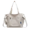 Large cream canvas tote bag with multiple pockets and a matching mini round pouch - White