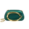Detail of dark green evening clutch bag with elegant gold curved metal ring ornament. - Green