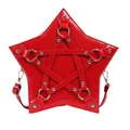 Detailed view of a red star-shaped crossbody bag with silver rivet hardware. - Red