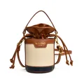 Detailed front view of a minimalist color-block bucket bag with a leather drawstring closure - Brown White Blue