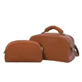 Close-up of brown sherpa cosmetic bag set showing plush texture and zippers - Brown