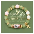 Detailed view of handmade hummingbird beaded bracelet with pastel and green beads. - Green Bird Style / With Card / Green