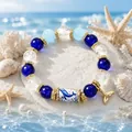 Elegant blue ocean-themed beaded bracelet with gold whale tail charm and dolphin pattern bead - Whale / Gift Box