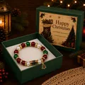 Close-up of Christmas beaded bracelet with tree charm inside a festive green gift box - Christmas Sock Style (Boxed) / Single Piece