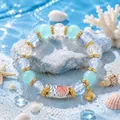Blue ocean DIY bead bracelet kit with shell charm and decorative coral background - Shell