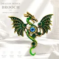 Vintage steampunk dragon wings brooch with green enamel and mechanical gear details - Dragon Brooch - Gold Green