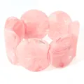 Chunky pink resin bracelet featuring irregular round beads and a marble-like translucent texture - Pink