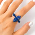 Elegant deep blue hexagonal lapis lazuli stone beaded ring worn on female finger - Lapis Lazuli