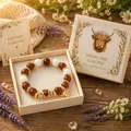 Close-up detail of handmade beaded bracelet featuring a highland cow charm in a gift box - U-Shape Bull Head / Color Box Packaging