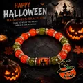 Spooky Halloween beaded bracelet with pumpkin witch hat charm and orange crystals - Wizard Hat Pumpkin Style