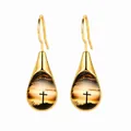 Elegant gold-toned stainless steel teardrop earrings with sunset cross silhouette design - Cross and Sunset Style