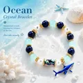 Mythical ocean crystal bracelet with blue shark charm and sea-themed beads - Dark Blue Shark