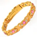 Goldfarbenes Magnetarmband mit rosa Herzkristallen und klaren Akzenten - Gekreuztes Herz / Gold Rosa Zirkonia