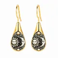 Elegant gold teardrop earrings with celestial sun and moon face artistic illustration - Retro Sun and Crescent Moon Totem Style