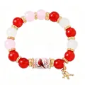 Vibrant red and pink beaded elastic bracelet with a cardinal bird charm detail. - Pink Bird Style / Single Piece